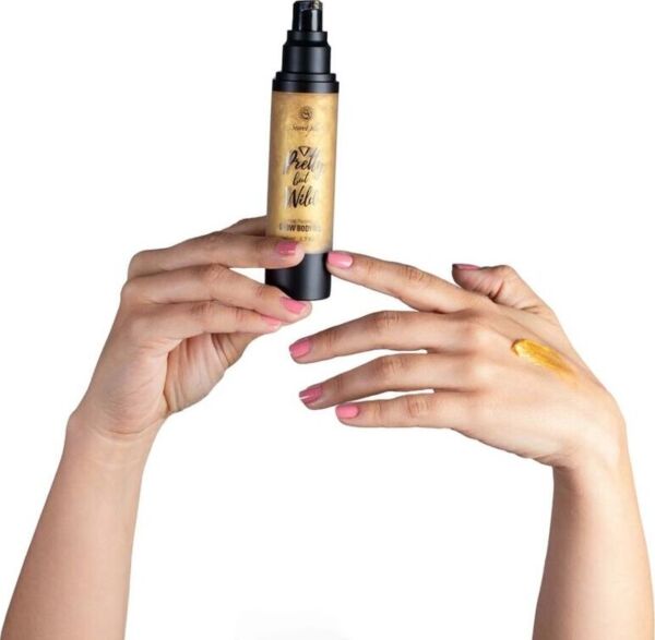 Flacon de l'huile corporelle illuminatrice Glow Body Oil Pretty But Wild de Secret Play